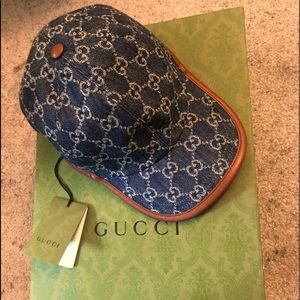 Gucci hat new with tags Denim blue with white Gucci symbols&brown leather strap